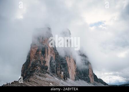 Mountains in the fog and clouds. Tre Cime di Lavaredo Stock Photo