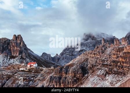 An extraordinary spectacle. Touristic buildings waiting for the people who wants goes through these amazing dolomite mountains Stock Photo