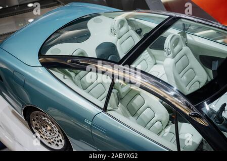 View from the top on panoramic roof and trunk of stylish, modern and expensive blue car with white interior Stock Photo