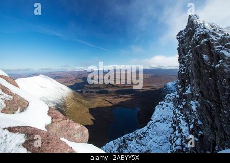 Lord Berkeley's Seat on the Munro An Teallach, one of Scotlands finest mountain traverses, above Dundonell, Scotland, UK looking down into Loch Toll a Stock Photo