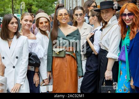 MILAN, ITALY - SEPTEMBER 19, 2019: Women before Fendi fashion show, Milan Fashion Week street style Stock Photo