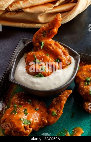 Hot and spicy buffalo wings with blue cheese dipping sauce Stock Photo