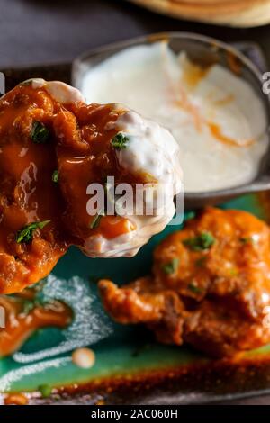 Hot and spicy buffalo wings with blue cheese dipping sauce Stock Photo