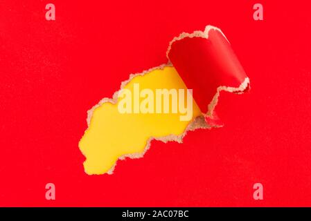 Torn red paper with space for your text message on yellow background. Mockup. Stock Photo