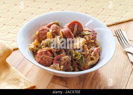Polish kielbasa potatoes onions and peppers hash with cole slaw Stock Photo