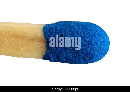extreme close-up of a blue match isolated against white background Stock Photo