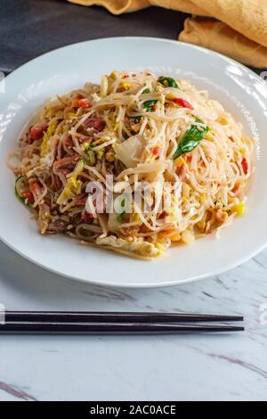 Chinese pork mei fun also known as Singapore-style noodles Stock Photo