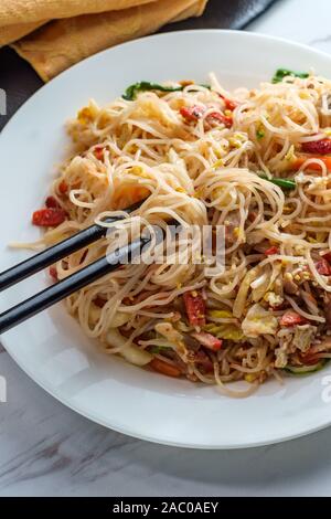 Chinese pork mei fun also known as Singapore-style noodles Stock Photo