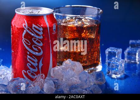 POZNAN, POL - NOV 22, 2019: Can and glass of Coca-Cola, a carbonated soft drink manufactured by The Coca-Cola Company headquartered in Atlanta, Georgi Stock Photo