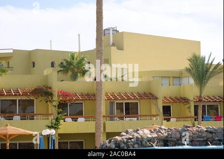 large yellow house with two residential floors. Stock Photo