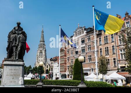 Anderlecht, Brussels / Belgium - 06 26 2019: Flags of Brussels, Anderlecht and Belgium at the statue of the World War at the Place de la Vaillance Dap Stock Photo