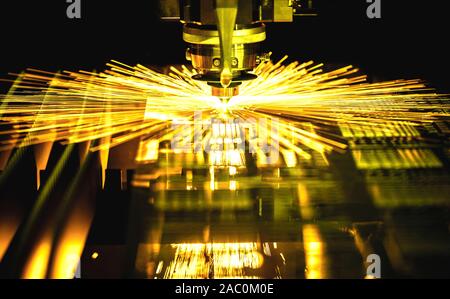 Machining CNC laser cutting metal sheet,High precision technology Stock Photo