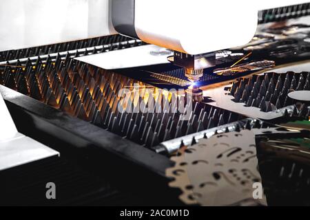 Machining CNC laser cutting metal sheet,High precision technology Stock Photo