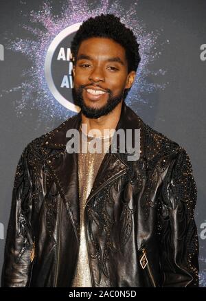 LOS ANGELES, CA - NOVEMBER 24: Chadwick Boseman poses in the press room during the 2019 American Music Awards at Microsoft Theater on November 24, 2019 in Los Angeles, California. Stock Photo