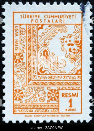 Turkish carpet detail on old postage stamp Stock Photo