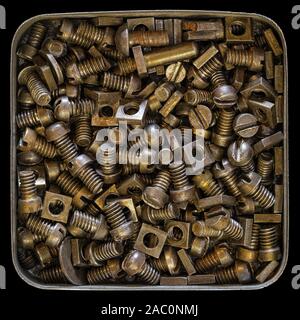 Tin with rusty old bolts and nuts Stock Photo