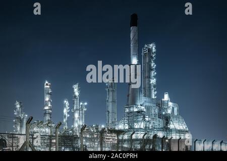 Close-up Industrial oil and gas refinery area at night. Stock Photo