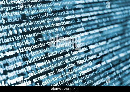 Compressed CSS programming code on screen in blue tones Stock Photo