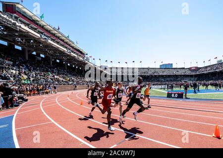 High School boys 4x400runners competing at the 2019 Penn Relay . Stock Photo