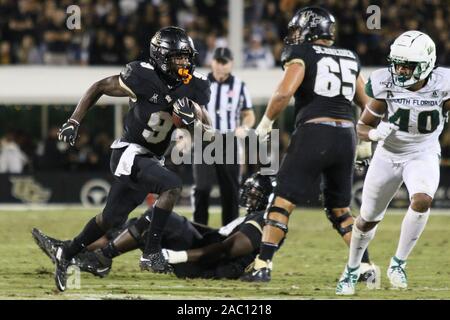 November 29, 2019: UCF Knights running back Adrian Killins Jr. (9) runs with the ball for a touchdown during the NCAA football game between the South Florida Bulls and the UCF Knights held at Spectrum Stadium in Orlando, Florida. Andrew J. Kramer/Cal Sport Media Stock Photo