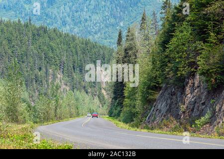 Traffic along the Cariboo Highway near the Ningunsaw River Ecological Preserve in British Columbia, Canada Stock Photo