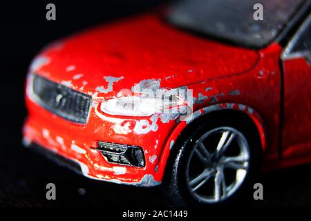 Umea, Norrland Sweden - October 29, 2019: red car with broken front and stripped varnish Stock Photo