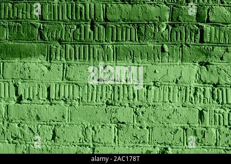 Painted brick wall close up. Abstract background green color toned Stock Photo