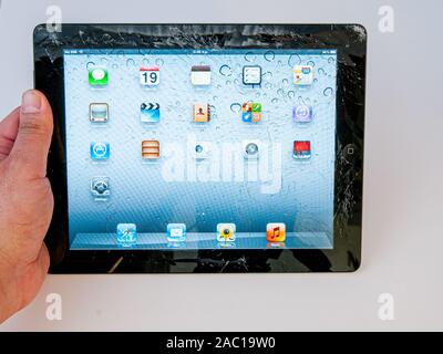 Nicosia, Cyprus – January  19, 2012: Front of a smashed  Apple Ipad 2 digital tablet on a white background Stock Photo