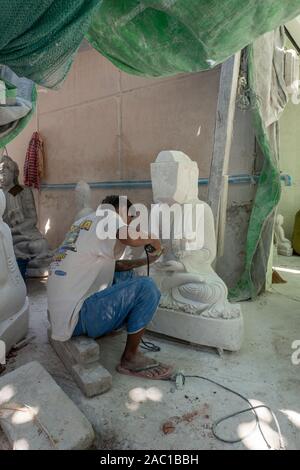 Marble stone statues of Buddha being carved in Mandalay, Myanmar Stock Photo