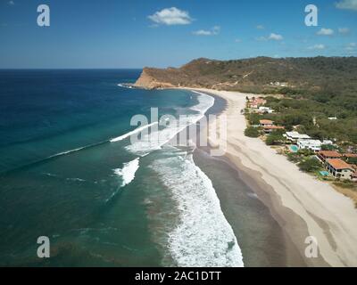 Aerial view of a luxury neighborhood with swimming pool and big ...