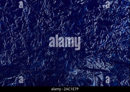 Blue plastic background. Shiny wrinkled crumpled bag surface Stock Photo