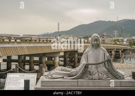 Statue of Murasaki Shikibu, author of the Tale of Genji, next to Uji bashi bridge in Uji, Kyoto Stock Photo