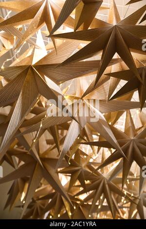 Star Christmas decorations inside the House at Waddesdon Manor, Waddesdon, Buckinghamshire, UK. Christmas Music theme. Christmas 2019 Stock Photo