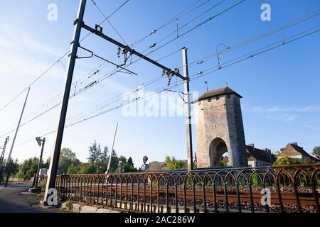 Europe, France, Nouvelle-Aquitaine, Orthez, 14th Century Stone Bridge across the Gave de Pau with Electrified Railway Line Stock Photo