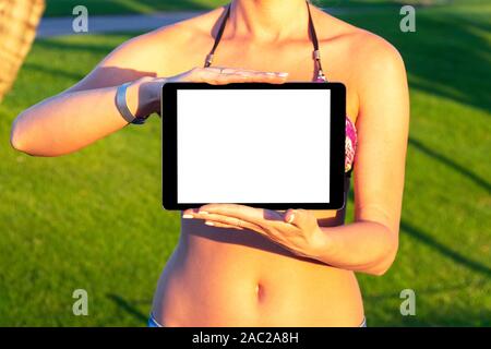 Tablet computer mockup in woman hand. New modern black tablet laptop mockup with blank white screen. Empty space for text. Copy space. Isolated white Stock Photo