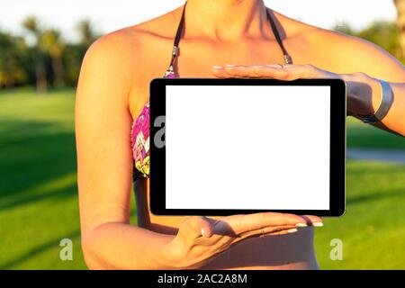 Tablet computer mockup in woman hand. New modern black tablet laptop mockup with blank white screen. Empty space for text. Copy space. Isolated white Stock Photo