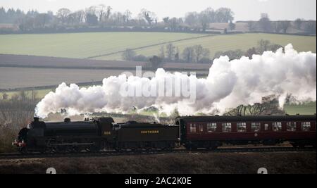 The S15 class steam locomotive 506 travels along the Mid Hants Railway ...