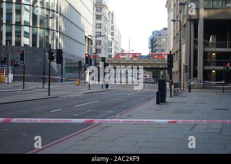 LONDON, UK, 30th Nov, 2019. Police cordon is seen at London Bridge, in London, . UK counter terrorism police on Saturday searched for clues into how a man imprisoned for terrorism offenses before his release last year managed to stab several people before being tackled by bystanders and shot dead by officers on London Bridge. Stock Photo