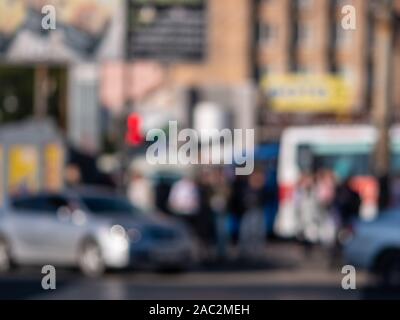 Out of focus background with people crossing street. Stock Photo