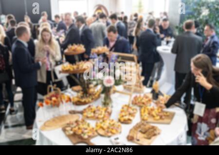 Abstract blured photo of business people socializing during banquet lunch break break at business meetin, conference or event Stock Photo