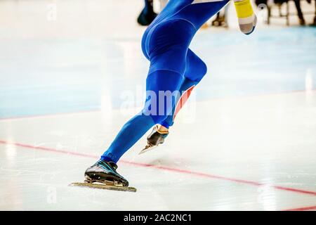start male athlete skater on speed skating competition Stock Photo