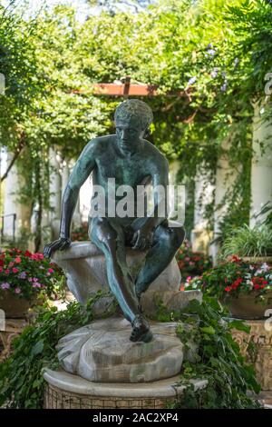 Capri, Italy - August 13, 2019: Bronze male scuplture in Villa San Michele garden on Capri Island Stock Photo
