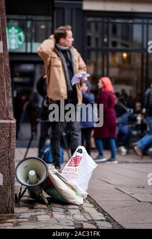 CARDIFF, United Kingdom. 30th Nov, 2019. Anti-Tory leaflet distribution organised by The Cardiff People's Assembly and Stand Up to Racism Cardiff at the Aneurin Bevan statue on Queens Street in Cardiff, Wales. © Credit: Matthew Lofthouse/Alamy Live News Stock Photo