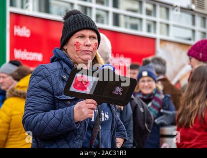 CARDIFF, United Kingdom. 30th Nov, 2019. Half & half scarves and other merchandise for sale on Queens Street ahead of the international rugby match in Cardiff, Wales. © Credit: Matthew Lofthouse/Alamy Live News Stock Photo