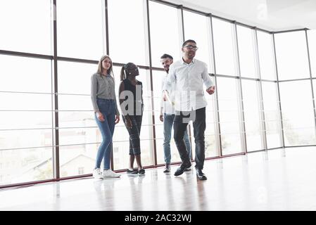 Having conversation. Friendly atmophere between four team workers on the break time Stock Photo