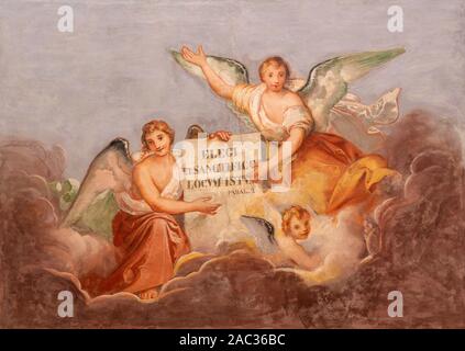 COMO, ITALY - MAY 8, 2015: The fresco of angels with the inscription from Old Tstament from the ceiling of church Basilica di San Fedele. Stock Photo