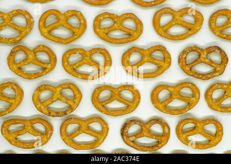 Abstract background top view of pretzels salted cookies placed on white background Stock Photo