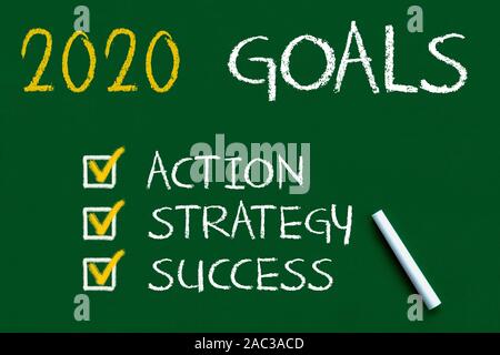 New Year 2020 Goals over on green Chalkboard Stock Photo