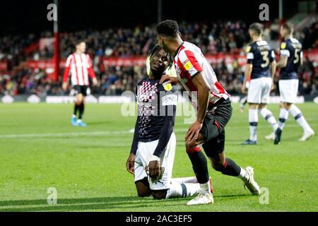 London, UK. 30th Nov, 2019. Pelly Ruddock Mpanzu of Luton Town is consoled by Ollie Watkins of Brentford during the EFL Sky Bet Championship match between Brentford and Luton Town at Griffin Park, London, England on 30 November 2019. Photo by Carlton Myrie. Editorial use only, license required for commercial use. No use in betting, games or a single club/league/player publications. Credit: UK Sports Pics Ltd/Alamy Live News Stock Photo