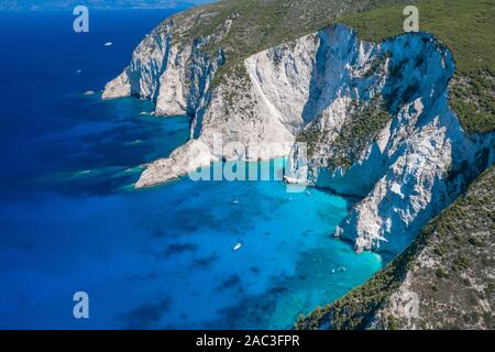 Aerial drone shot of Zakynthos Navagio beach cliffs by blue Ionian sea in summer Stock Photo